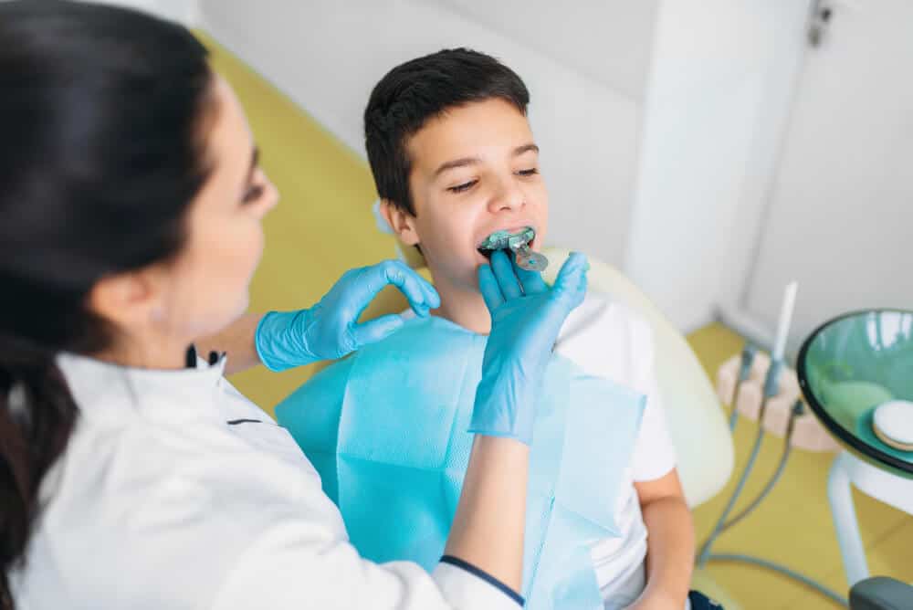 Footy player wearing a custom mouthguard in Gordon for protection and performance