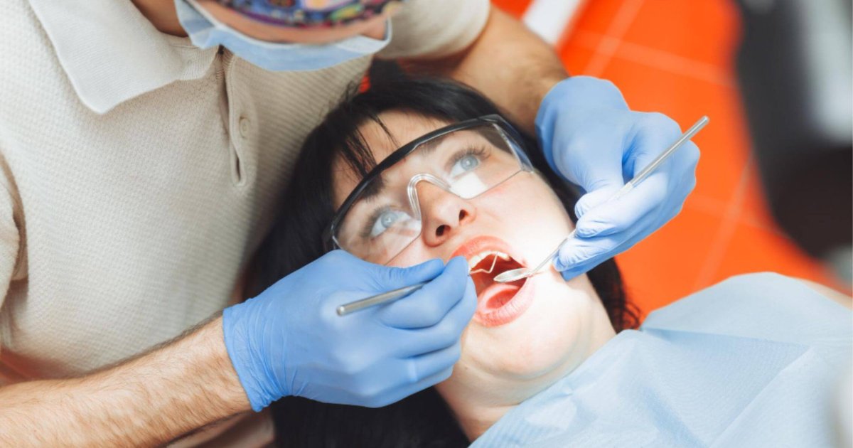 Gordon dentist examining a patient's mouth