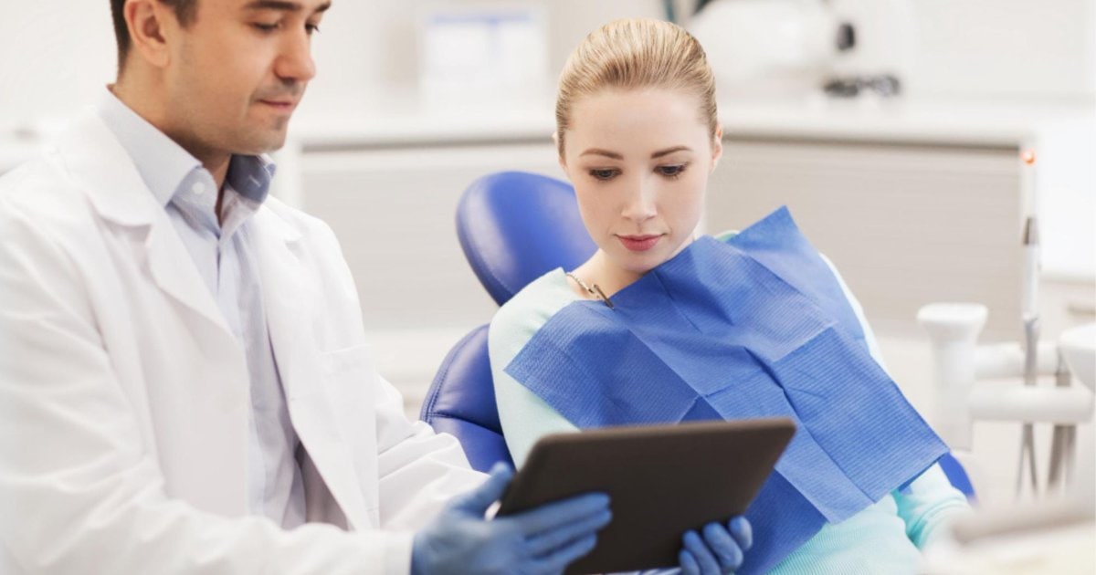 Dentist discussing gum recession treatment options with a patient in Gordon