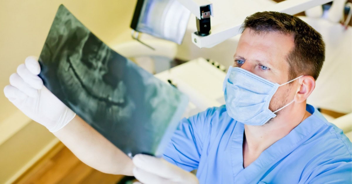 dentist reviewing a dental Xray in Gordon